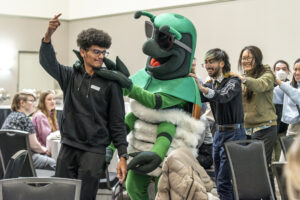interacting with a bug mascot