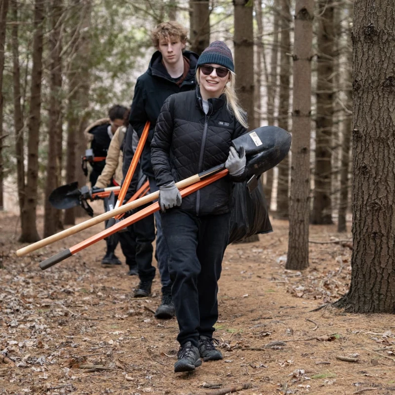 Youth Nature Keepers walking through a forest