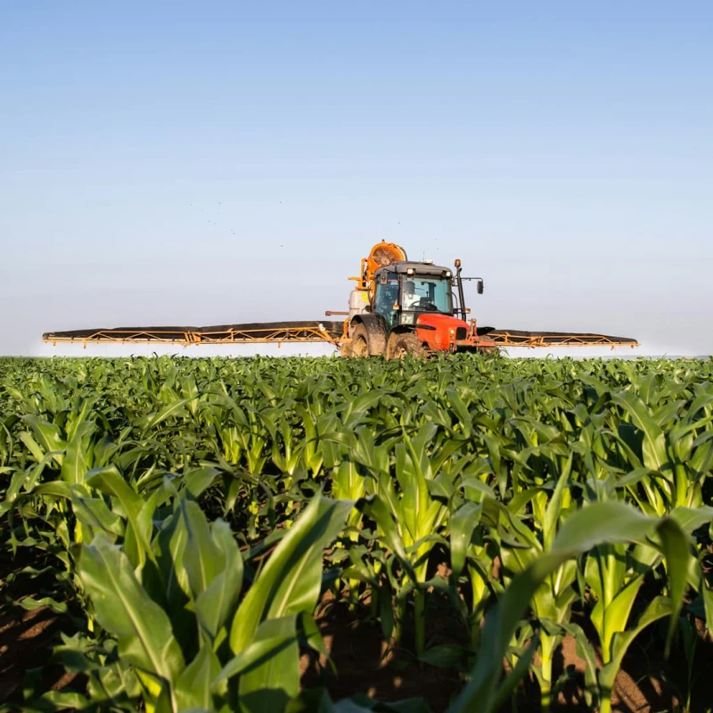 Tractor spraying crops